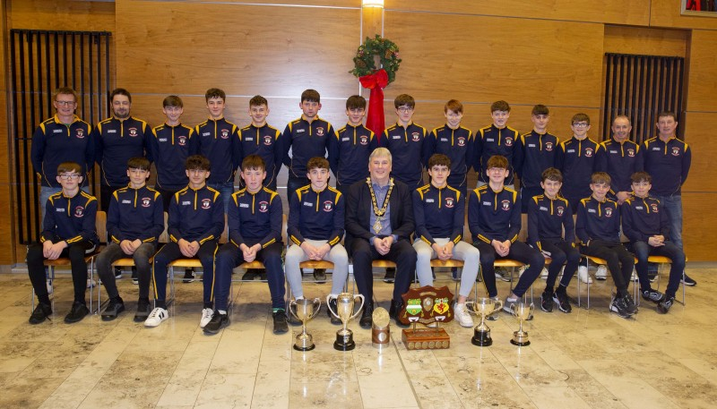 All-Ireland Féile champions from Glenariffe Oisins pictured at Cloonavin with the Mayor of Causeway Coast and Glens Borough Council Councillor Richard Holmes who hosted a reception in recognition of their success.