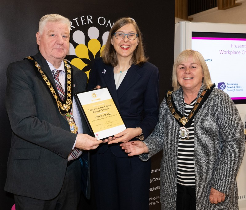 Mayor of Causeway Coast and Glens, Councillor Steven Callaghan alongside Deputy Mayor Councillor Margaret-Anne McKillop as the Mayor accepts the Gold Workplace Charter for Council at the Onus Awards 2023.