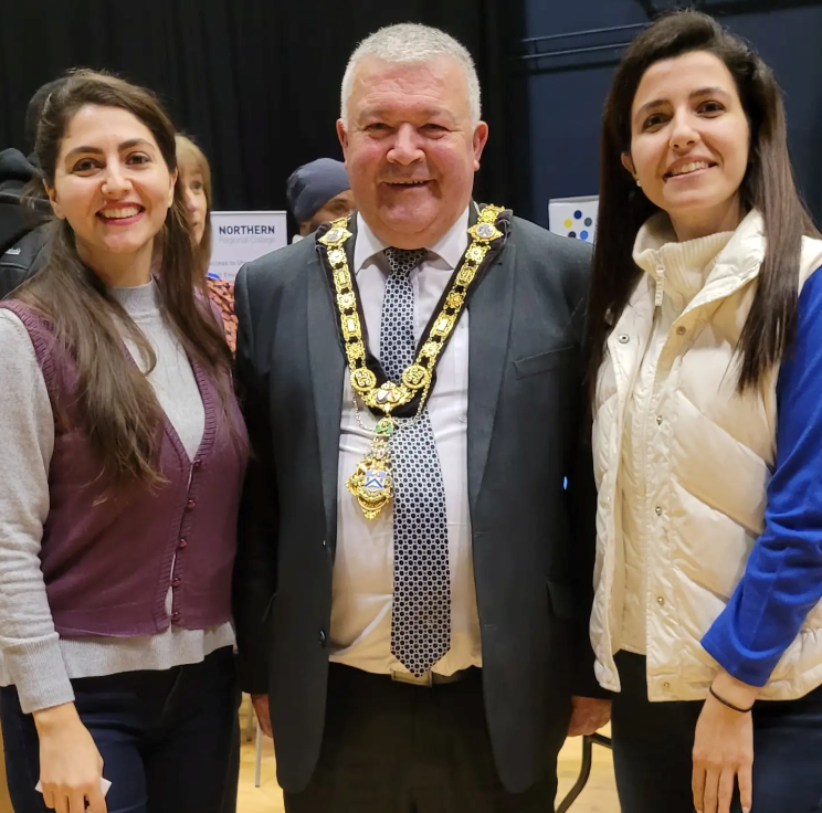 Behnez and Elnez, sisters from Iran pictured with the Mayor, Councillor Ivor Wallace.