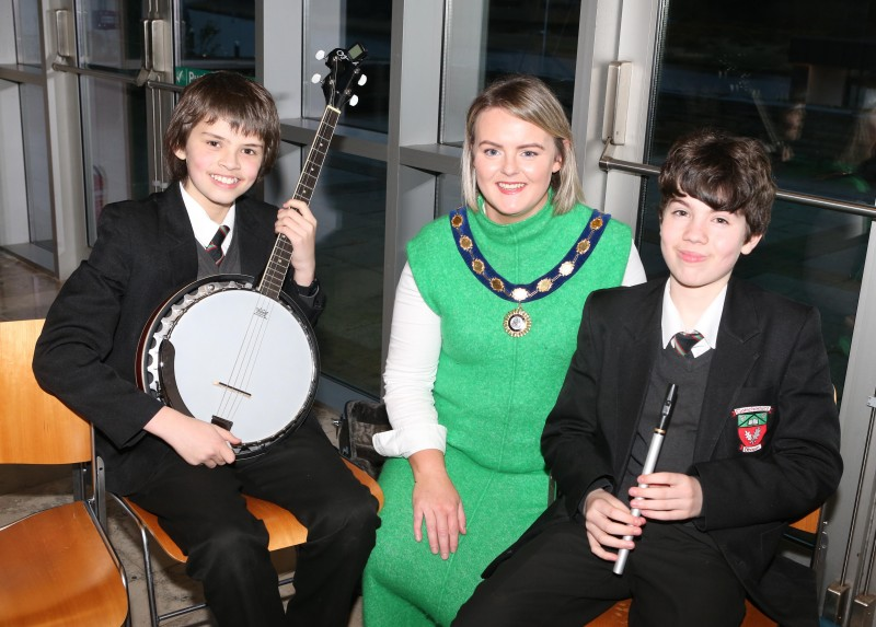 Councillor Kathleen McGurk, Deputy Mayor of Causeway Coast and Glens Borough Council, pictured with young musicians from Gaelcholáiste Dhoire in Dungiven who attended the Irish Language Week celebration in Cloonavin.