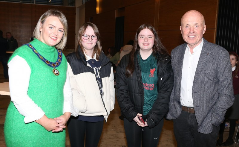 Councillor Kathleen McGurk, Deputy Mayor of Causeway Coast and Glens Borough Council, pictured with Councillor Sean McGlinchey, Nicole McGlinchey and Enya McCuske and some of those who attended the Irish Language Week celebration in Cloonavin.