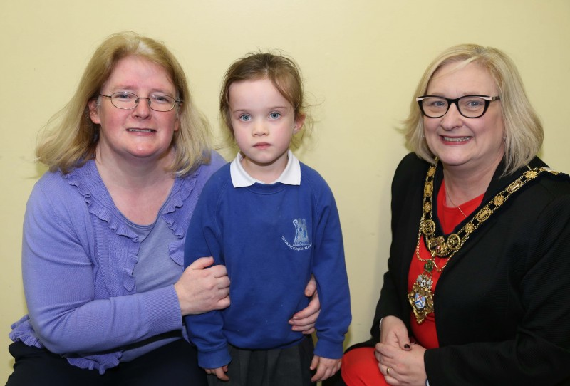 Primary 1 pupil Sofia McAuley pictured with the Mayor of Causeway Coast and Glens Borough Council Councillor Brenda Chivers and school Principal Brídín Ní Dhonnghaile.