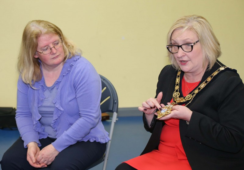The Mayor of Causeway Coast and Glens Borough Council Councillor Brenda Chivers talks about her chain as school Principal Brídín Ní Dhonnghaile looks on.