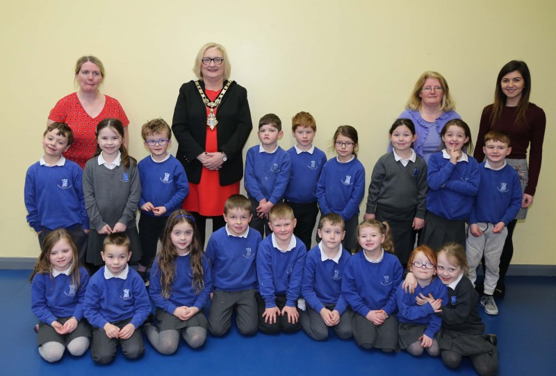 The Mayor of Causeway Coast and Glens Borough Council Councillor Brenda Chivers pictured with pupils and staff during her visit to Gaelscoil an Chaistil in Ballycastle.