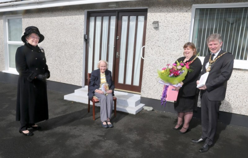 Isabelle Claypole, who celebrated her 100th birthday on April 10th 2021, receives her commemorative centenary coin from the Mayor of Causeway Coast and Glens Borough Council Alderman Mark Fielding and Mayoress Mrs Phyllis Fielding. Also included in the pictured is Lady Karen Girvan.