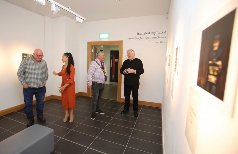 Writer John Brown, Esther Alleyne from Roe Valley Arts and Cultural Centre, the Mayor of Causeway Coast and Glens Borough Council, Councillor Ivor Wallace, and photographer James Hughes pictured at the launch of the Istanbul Alphabet exhibition.