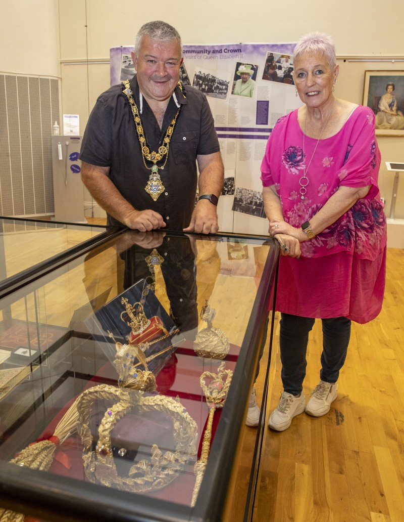 The Mayor of Causeway Coast and Glens Borough Council Councillor Ivor Wallace pictured with Museums Officer Joanne Honeyford during his visit to the Community and Crown exhibition.