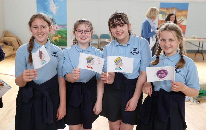 Pupils show off their creative flag designs made at the Museums Service workshop.
