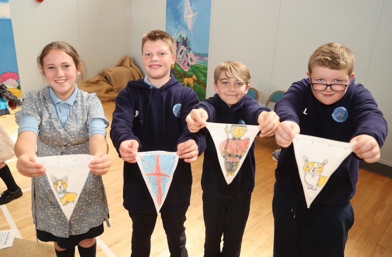 Pupils show of their Platinum Jubilee bunting designs.