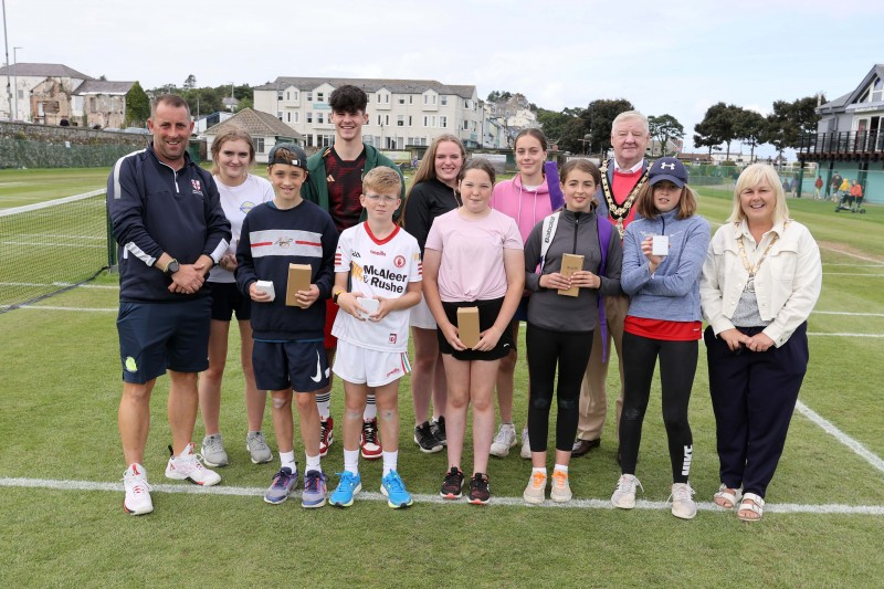 Mayor of Causeway Coast and Glens, Councillor Steven Callaghan, Deputy Mayor, Councillor Margaret-Anne McKillop, with referee Sean Moloney and winners of the Junior Tennis Tournament at the Alex McFarland Tennis Courts, Ballycastle.