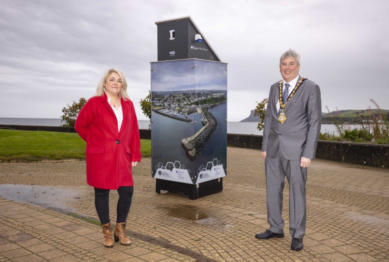 The Mayor of Causeway Coast and Glens Borough Council Councillor Richard Holmes pictured in Ballycastle where four new light boxes are on display featuring iconic imagery from around the Borough with Town & Village Project Officer Geraldine Wills.