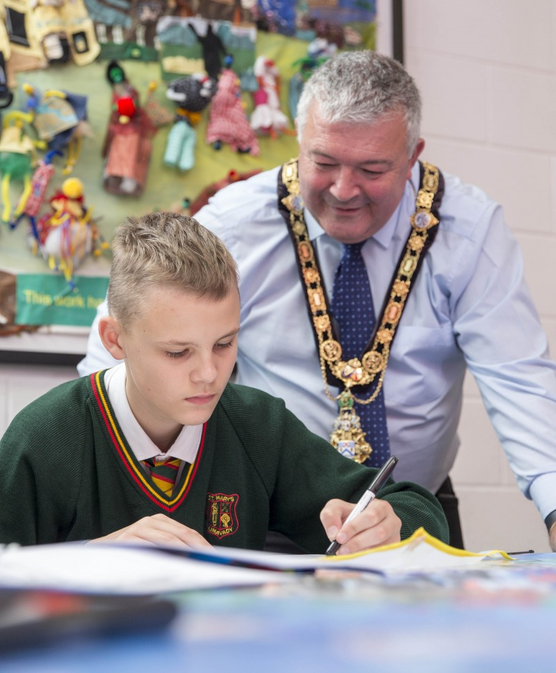 The Mayor of Causeway Coast and Glens Borough Council, Councillor Ivor Wallace, looks on during the kite-making workshop.