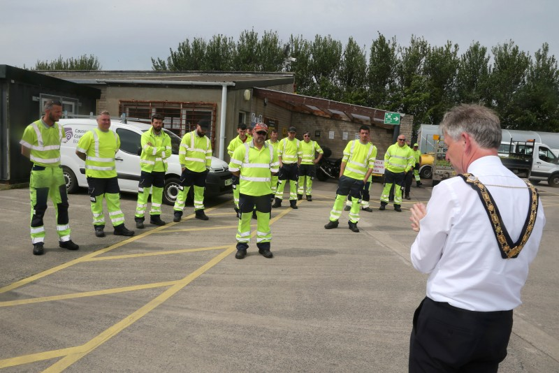 The Mayor of Causeway Coast and Glens Borough Council Alderman Mark Fielding chats with staff during his visit to Limavady depot.