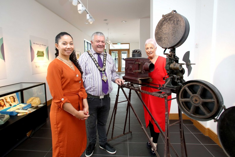 Arts Officer Esther Alleyne, Museums Officer Joanne Honeyford and the Mayor of Causeway Coast and Glens Borough Council Councillor Ivor Wallace pictured at the 100 Objects for 100 Years exhibition which is now open at Roe Valley Arts and Cultural Centre with a Gaumont Cinema Projector from the 1920s which was used in St Patrick’s Hall, Castle Street, Ballymoney.