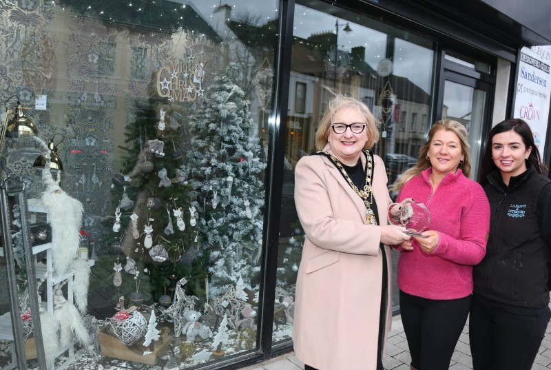 Lorraine Armstrong and Annabel Irwin, from LA Paints and Interiors, runner-up of the Christmas window competition in Limavady receive their award from the Mayor of Causeway Coast and Glens Borough Council Councillor Brenda Chivers.