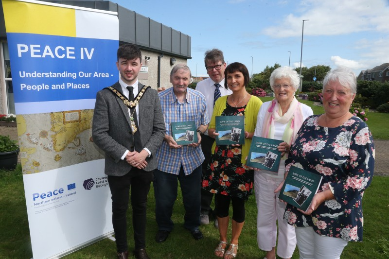 The Mayor of Causeway Coast and Glens Borough Council Councillor Sean Bateson pictured with some of the Clanmil Housing Association participants and Patricia Crossley, Vice Chair of the PEACE IV Partnership at the launch of the ‘Lore of the Land’ book.