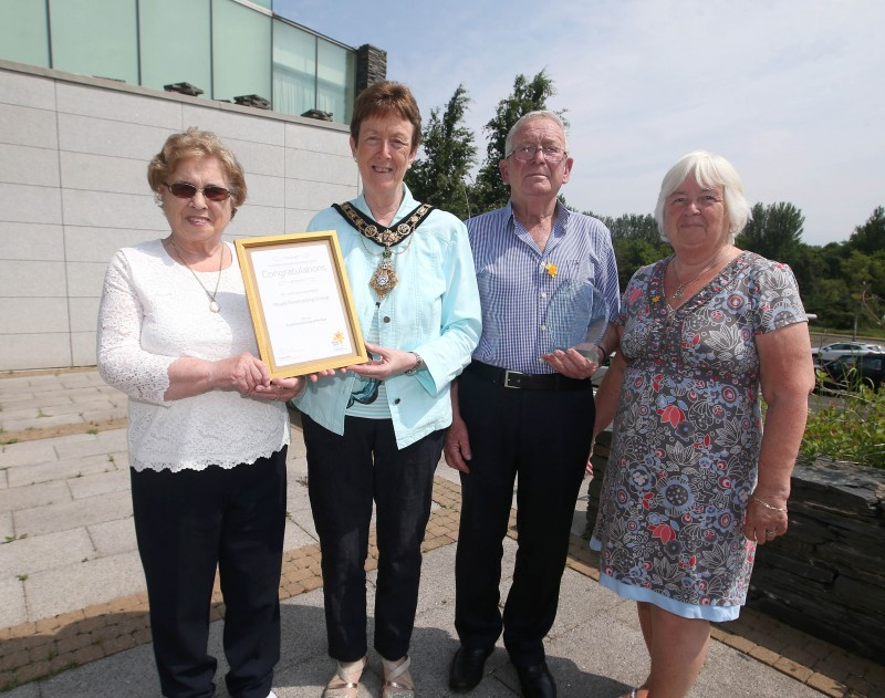The Mayor of Causeway Coast and Glens Borough Council Councillor Joan Baird OBE pictured with Philomena McKiernan, Stanley Jamison and Mary O'Connor with the Excellence Award received by the group for Fundraising Group of the Year.