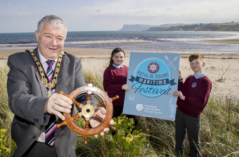 Mayor of Causeway Coast and Glens, Councillor Ivor Wallace with Riley Morris and Maia Kinney, Head Boy and Head Girl of Ballycastle Integrated PS, at the launch of Rathlin Sound Maritime Festival 2023.