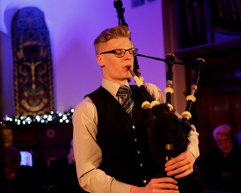 Piper Robbie Bellingham performs in Holy Trinity Church.