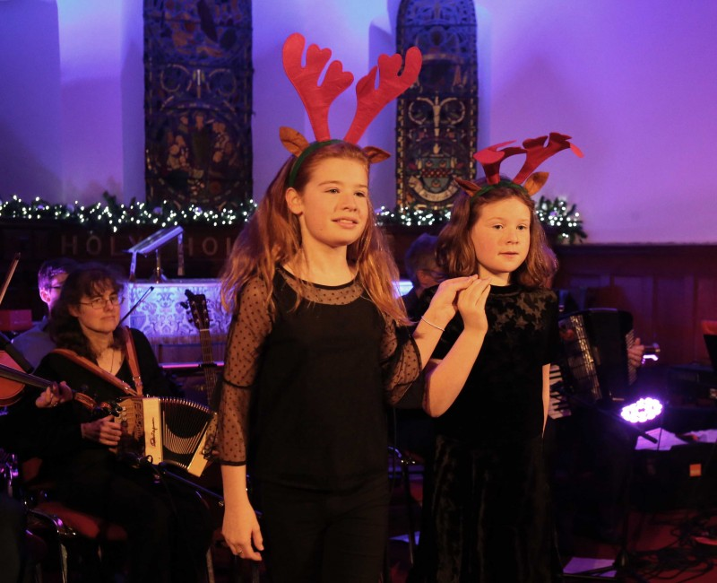Young dancers perform the 'Reindeer Dance' during the event in Holy Trinity Church.