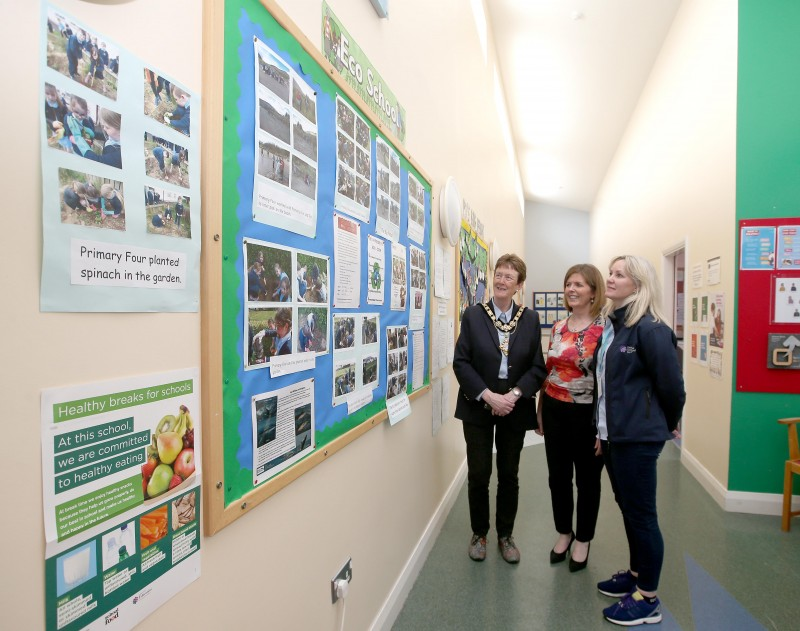 Principal Mrs Roisin McCarry showcases the school's Eco Schools works to the Mayor of Causeway Coast and Glens Borough Council Councillor Joan Baird OBE and Recycling Officer Janice Dunlop.