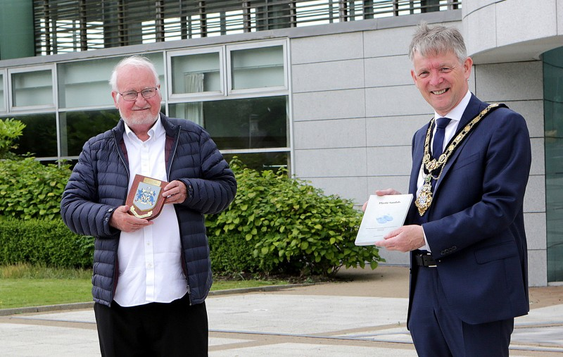 Douglas McClarty, author of Plastic Sandals, pictured with the Mayor of Causeway Coast and Glens Borough Council Alderman Mark Fielding.
