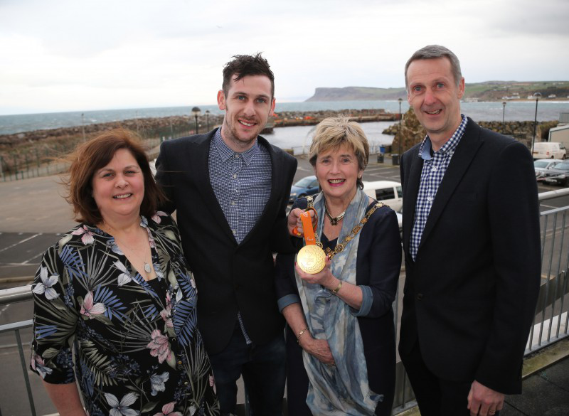 Paralympian Michael McKillop pictured with his parents Paddy and Cathryn and the Mayor of Causeway Coast and Glens Borough Council, Alderman Maura Hickey.