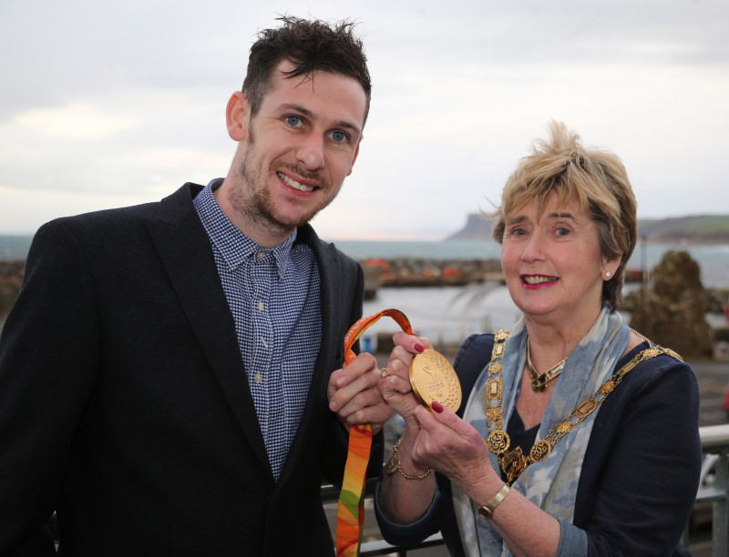 The Mayor of Causeway Coast and Glens Borough Council, Alderman Maura Hickey, pictured with one of Michael’s gold medals.