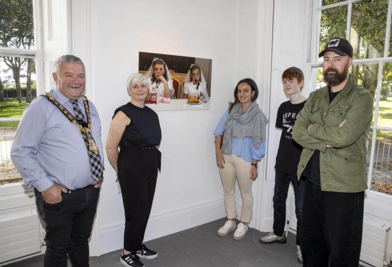 The Mayor of Causeway Coast and Glens Borough Council, Councillor Ivor Wallace, Shauna McNeilly Arts & Cultural Facilities Officer, Bronagh Rooney, Cathal’s son Darren and photojournalist Cathal McNaughton pictured at the opening of his new exhibition, Reflection, at Flowerfield Arts Centre.