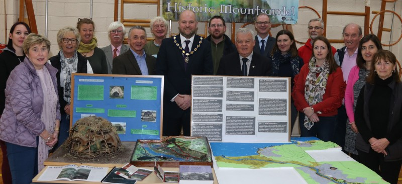The Deputy Mayor of Causeway Coast and Glens Borough Council Councillor Trevor Clarke pictured with some of those who organised and participated in the Mountsandel Field School Project.