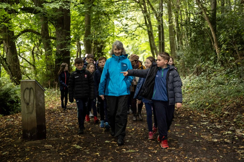 Volunteer Patricia Condron, with pupils from St Canice’s Primary School Feeny, in Mountsandel Wood.