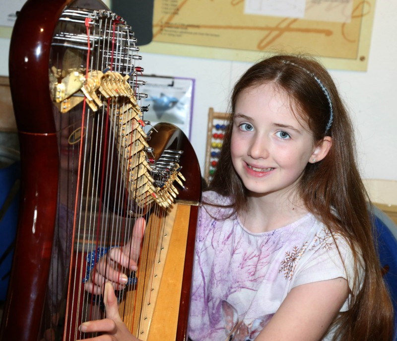 Harp player Aoife Kinney pictured at the celebration event to mark the reopening of Ballycastle Museum for the summer season.