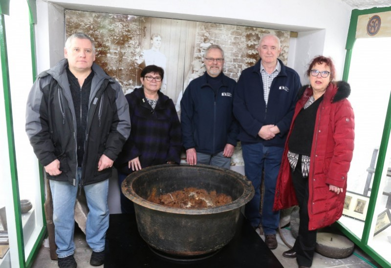 Members of the Friends of Ballycastle Museum group pictured with Helen Perry, Museum Services Development Manager and the porridge pot which is on display at Ballycastle Museum.