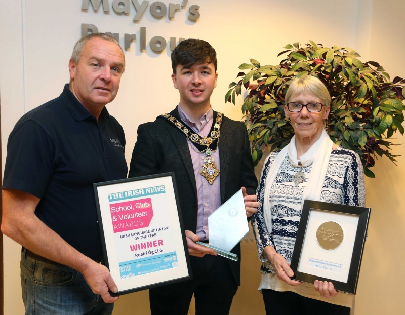 The Mayor of Causeway Coast and Glens Borough Council Councillor Sean Bateson pictured with Fergus McAllister and Anne Marie McNaughton representing Ruairi Og GAA Club in Cushendall and Gaeil nc Glinntí, who have been recognised for their promotion of the Irish language.