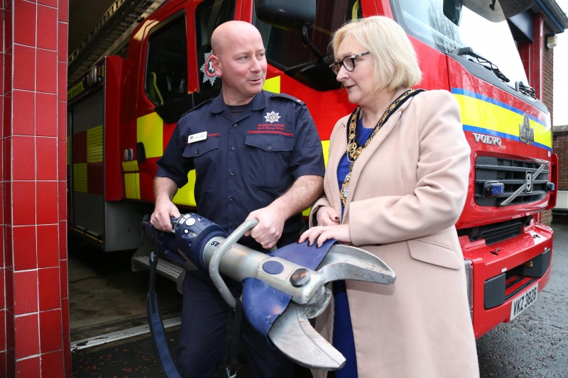 The Mayor of Causeway Coast and Glens Borough Council Councillor Brenda Chivers is shown a piece pf cutting equipment by Crew Commander Alan Millar during her recent visit to Coleraine Fire Station.