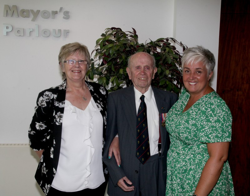 Norman Irwin pictured with Norma Auld (left), Senior Care Assistant at Killowen House in Coleraine where Norman now lives, along with Killowen House Manager Brenda Cunningham.