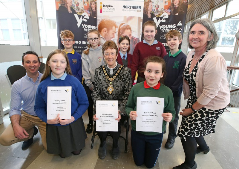 The Mayor of Causeway Coast and Glens Borough Council Councillor Joan Baird OBE pictured with primary school pupils from the Ballymoney area who took part in the Business Masterclass along with representatives of Young Enterprise NI.