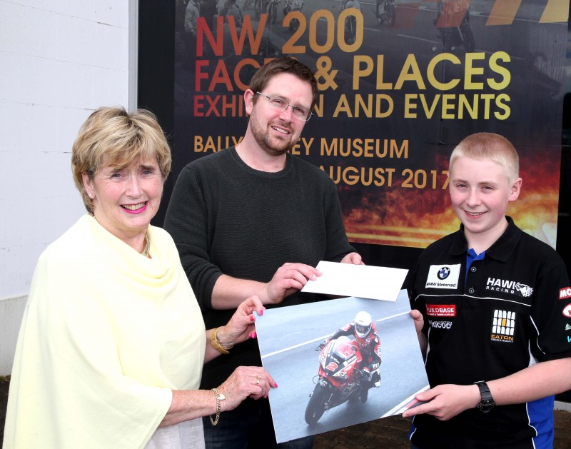 Pictured receiving his prize in the recent NW200 photography competition is James Shaw from Portadown with Alderman Maura Hickey and Nic Wright from Causeway Coast and Glens Borough Council’s Museum Services.