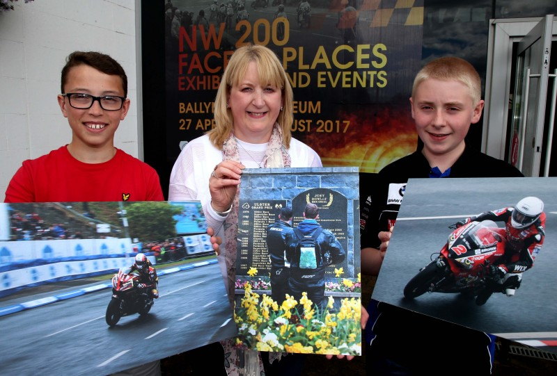 The winning photographers in the ‘Capture the Moment’ competition, Petula Blair, Caleb Moore and James Shaw, display their images.