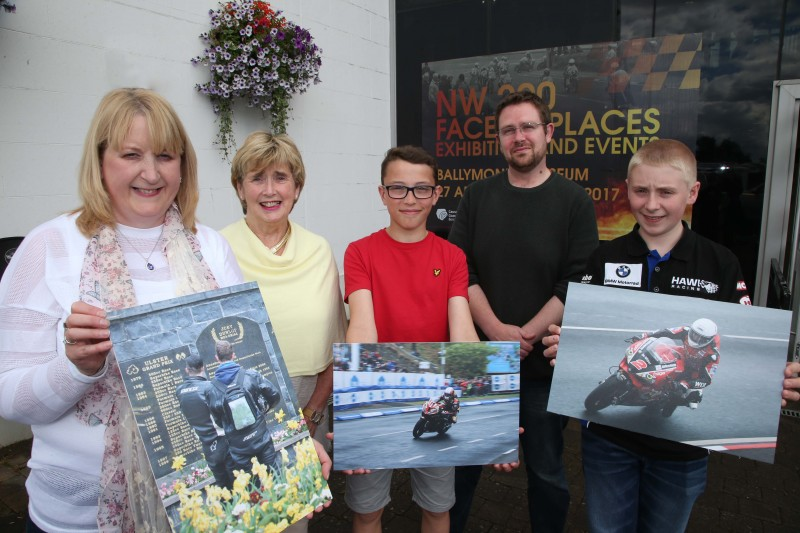 Displaying their winning entries in this year’s ‘Capture the Moment’ International NW 200 photography competition are Petula Blair, Caleb Moore and James Shaw alongside Alderman Maura Hickey and Nic Wright, Causeway Coast and Glens Borough Council’s Museum Services.