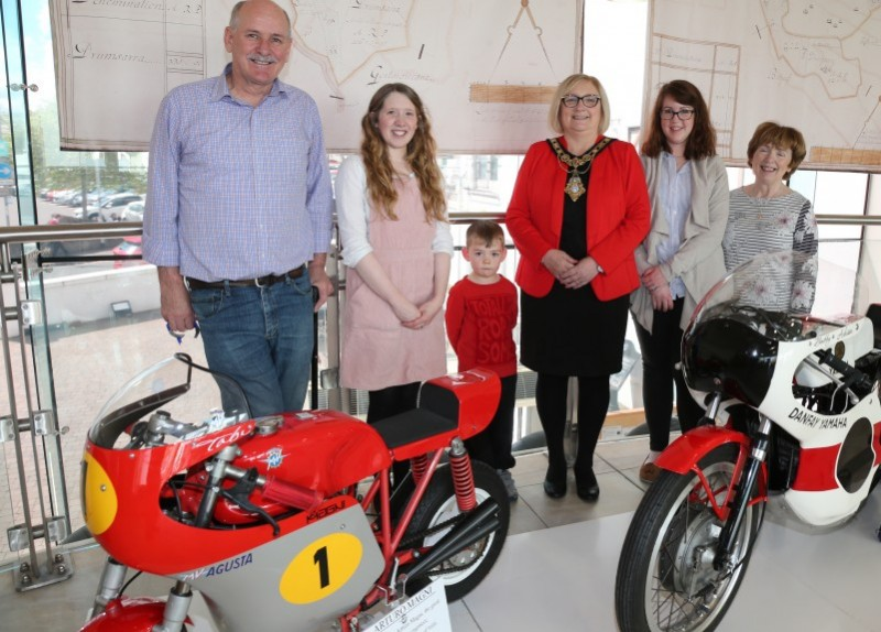 The Mayor of Causeway Coast and Glens Borough Council Councillor Brenda Chivers pictured with Museum Officers Jamie Austin and Sarah Carson alongside Bobby Acheson and his grandparents at the ‘90 Years of NW 200’ exhibition at Ballymoney Museum.