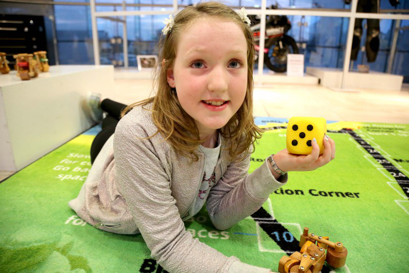 Lucy Gallagher enjoys the activities on offer for children at the NW200 Faces and Places exhibition.
