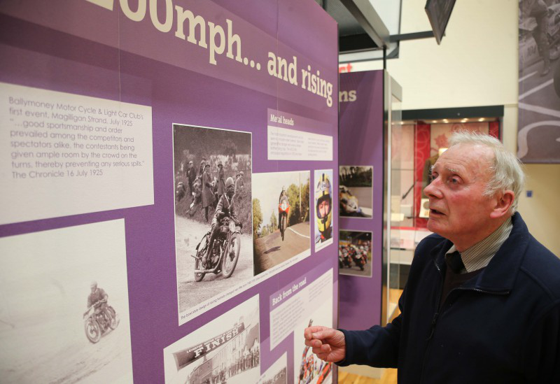 Willie Logan enjoying some of the archive photographs on display at the NW200 Faces and Places exhibition.