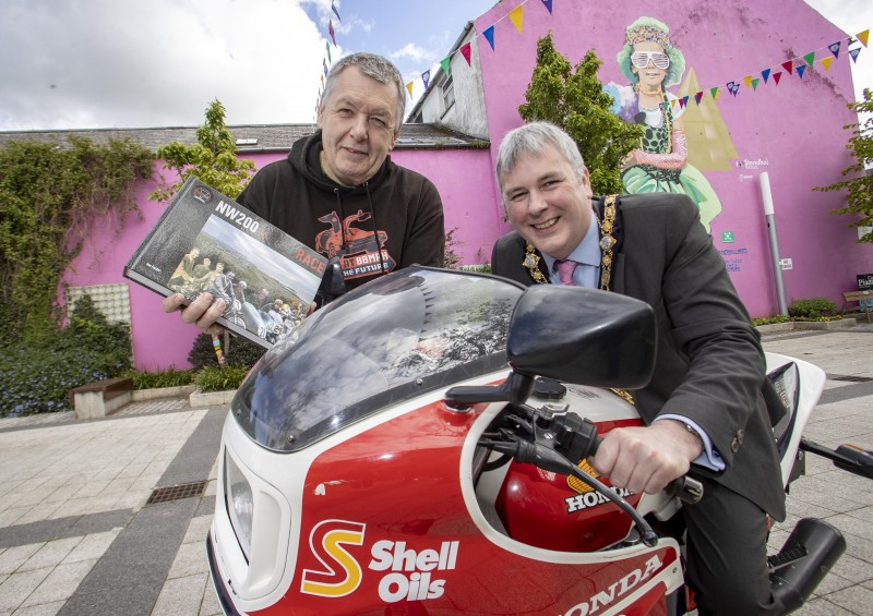 The Mayor of Causeway Coast and Glens Borough Council, Cllr Richard Holmes, sits on a 1982 Honda CB1100RC (as raced by Ro Haslam and paraded at Macau GP) to mark the launch of a new photographic exhibition at Roe Valley Arts and Cultural Centre, charting the history of the NW200. The exhibition is based on the book ‘NW200 90th Road & Race’ and the Mayor was joined by author, Ian Foster.