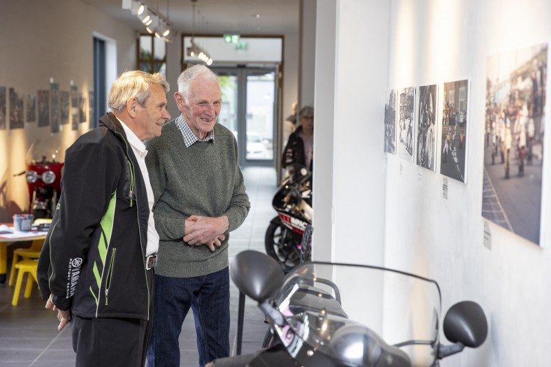 Two-time NW200 winner, Dick Creith (right), reflects over the new photographic exhibition at Roe Valley Arts and Cultural Centre, which features historic images taken from the book the ‘NW200 90th Road & Race’, by Ian Foster.
