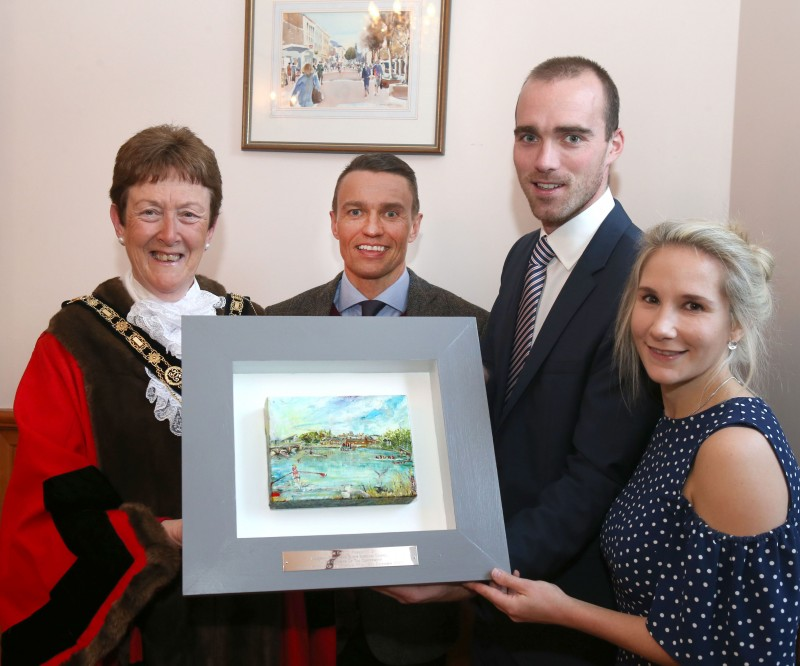 Peter Chambers, along with his wife Elizabeth, pictured with the Mayor of Causeway Coast and Glens Borough Council, Councillor Joan Baird OBE and Chief Executive David Jackson. Peter was presented with a unique painting by Sara Cunningham Bell depicting a rowing scene on the River Bann to mark the conferment of the Freedom of the Borough.