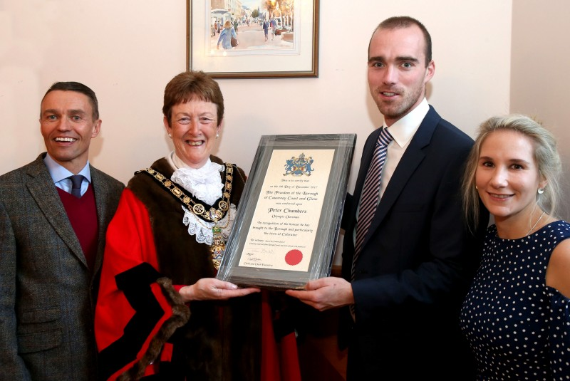 Olympic rower Peter Chambers receives his Freedom of the Borough certificate from the Mayor of Causeway Coast and Glens Borough Council, Councillor Joan Baird OBE. Also included is David Jackson, Chief Executive of Causeway Coast and Glens Borough Council and Peter’s wife Elizabeth.
