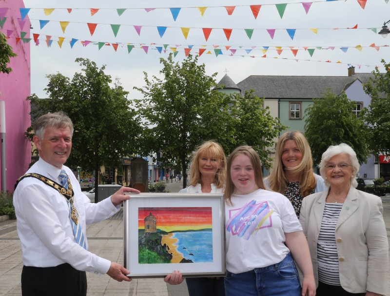 The Mayor of Causeway Coast and Glens Borough Council Alderman Mark Fielding receives the new painting for the Mayor’s Parlour from artist Tori McNeill. Also pictured are Tori’s mum Dara, granny Iris and friend Shirley Bradley.