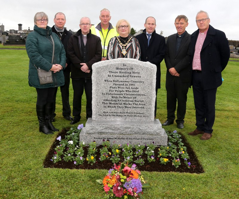 The Mayor of Causeway Coast and Glens Borough Council, Councillor Brenda Chivers pictured with Carmel Mc Caughern, Keath Beattie, Fr Francis O’Brien, Andrew McMullan, Reverend Hugh Cubitt and Reverend Andrew Sweeney at the new memorial headstone to remember those laid to rest in Ballymoney Cemetery’s ‘Paupers’ Graves’.