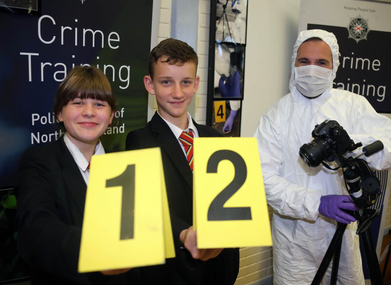 Pupils Leah Craig and Jack Carmichael from Limavady High School pictured with crime scene equipment during the information event on Wednesday 21st June.